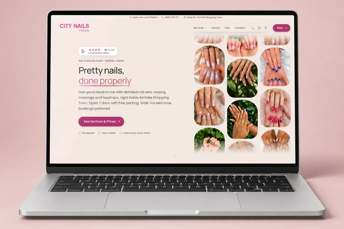 City Nails & Beauty website displayed on a silver laptop in a blush-pink studio